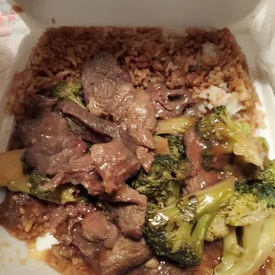 beef, broccoli, and rice in a styrofoam container