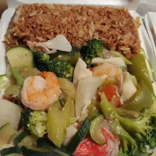 shrimp, broccoli, and rice in a styrofoam container