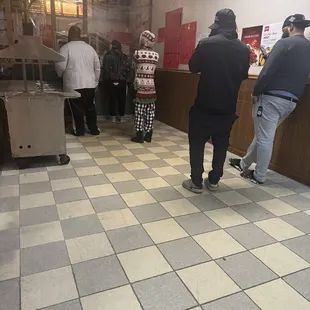 people standing in line at counter