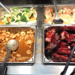 a variety of food items in a buffet