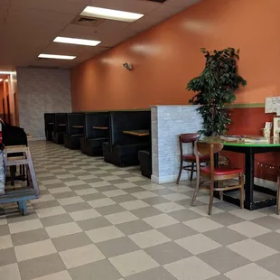 a dining area with tables and chairs