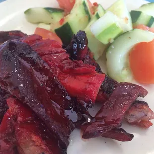 a plate of meat and vegetables
