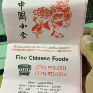 a person holding a chinese food receipt