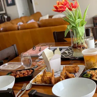 a dining table with food and drinks