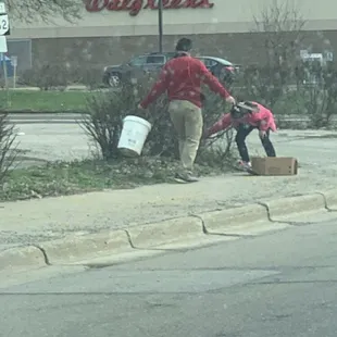 China Star has kids outside with food tongs picking up trash