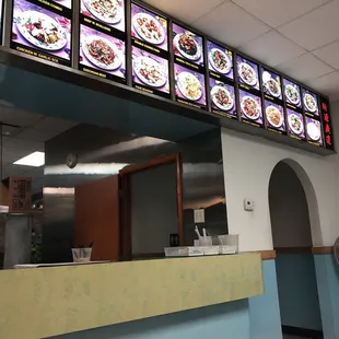 a restaurant counter and menus