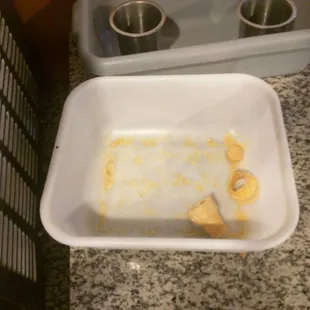 Not a bowl in sight... But there is a solitary broken ice cream cone to put your spoiled milk consistency soft serve into