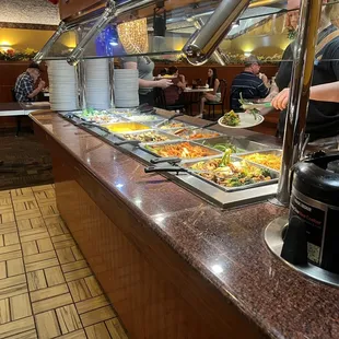 a buffet with a variety of food items