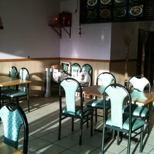 a restaurant with tables and chairs