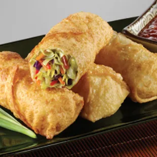 a plate of fried food with dipping sauce