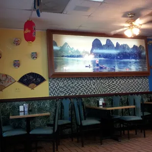 a dining area with tables and chairs
