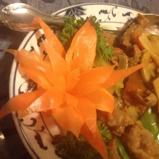a plate of food with carrots and broccoli