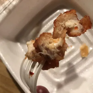 a piece of fried chicken on a fork