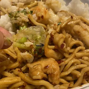 a plate of noodles and broccoli