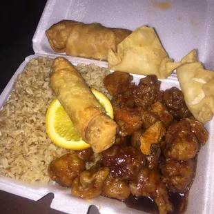 Lunch special orange chicken, egg roll, steak &amp; cheese egg roll &amp; crab rangoon.