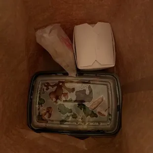 I took out the quart of wonton soup, I'm sitting in a motel room, am I blind or is there no way for me to eat this except with my hands?