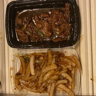 a container of noodles and a container of beef