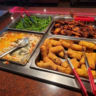 a variety of food items in a buffet