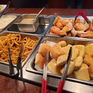 a variety of food items in a buffet