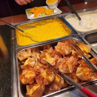 a buffet with a variety of food items