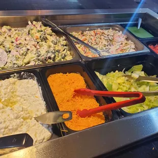 a variety of food items in a buffet