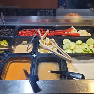 a variety of salads and condiments