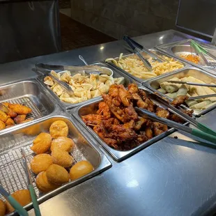 a variety of food items in a buffet