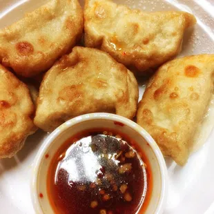 Fried dumplings with sweet and sour dipping sauce.