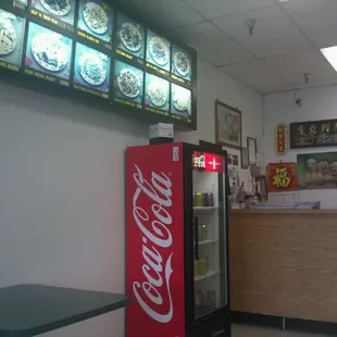 a coca cola machine in the foreground