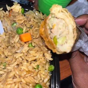 a plate of fried rice and vegetables