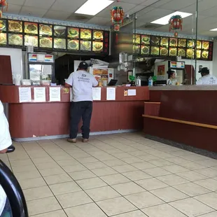 a woman standing at the counter