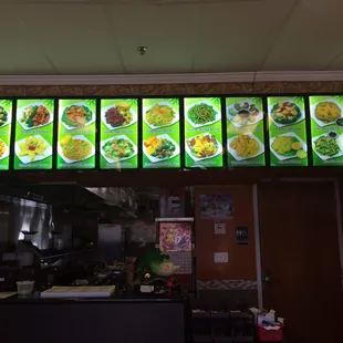 a restaurant's menu displayed on a large screen