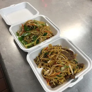 two take out containers of food