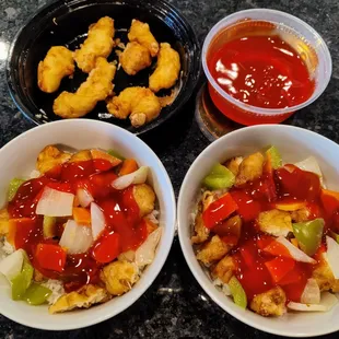 Plenty to eat! A dinner sized portion of the sweet and sour chicken re-plated to two bowls plus enough for a snack later.