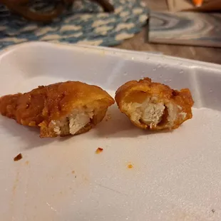 Tiny pieces of chicken in lots of breading.