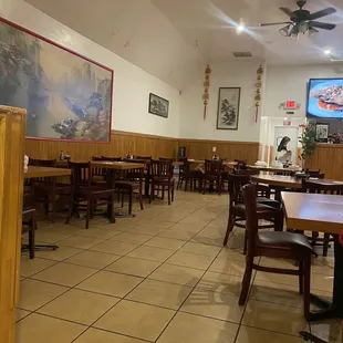 a restaurant with tables and chairs