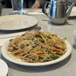 a plate of noodles and vegetables