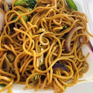 noodles and broccoli in a styrofoam container