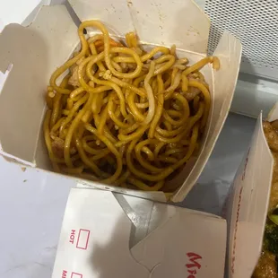 a box of noodles and a sandwich