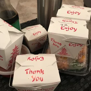 a variety of take out boxes on a table