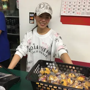 Ms Liu at cash register...a friendly smile