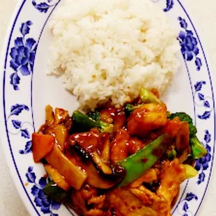 a plate of food with rice and vegetables