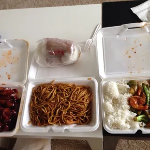 a variety of food in a styrofoam container