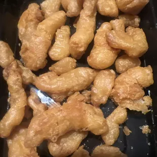 a tray of fried chicken nuggies