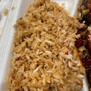 Friend rice has egg and veggies in it. This is white rice with soy sauce.