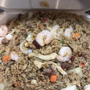 shrimp and rice in a styrofoam container