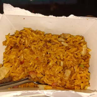 a bowl of rice with a fork in it