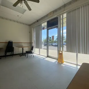 an empty room with a fan