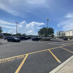 a parking lot with cars parked in it