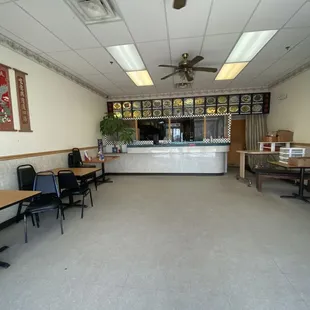 an empty restaurant with tables and chairs